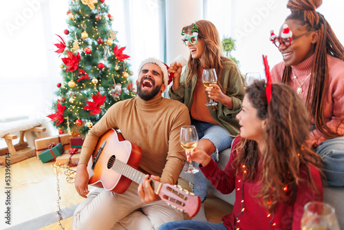 Photography Friends drinking wine and singing Christmas songs