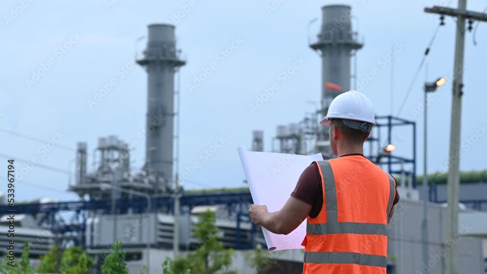 Two engineer working at power plant,Work together happily,Help each other analyze the problem,Consult about development guidelines Two engineer working at power plant,Work together happily,Help each other analyze the problem,Consult about development guidelines