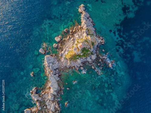 Sveta Nedelja is an islet on the Adriatic Sea, in Montenegrin municipality of Budva. It is located opposite the town of Petrovac na Moru in Montenegro. It has a small church on it Portrait of a