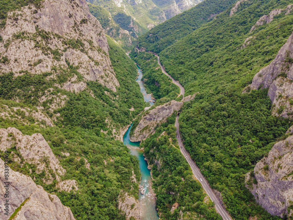 The purest waters of the turquoise color of the river Moraca flowing among the canyons. Travel around Montenegro concept Portrait of a disgruntled girl sitting at a cafe table