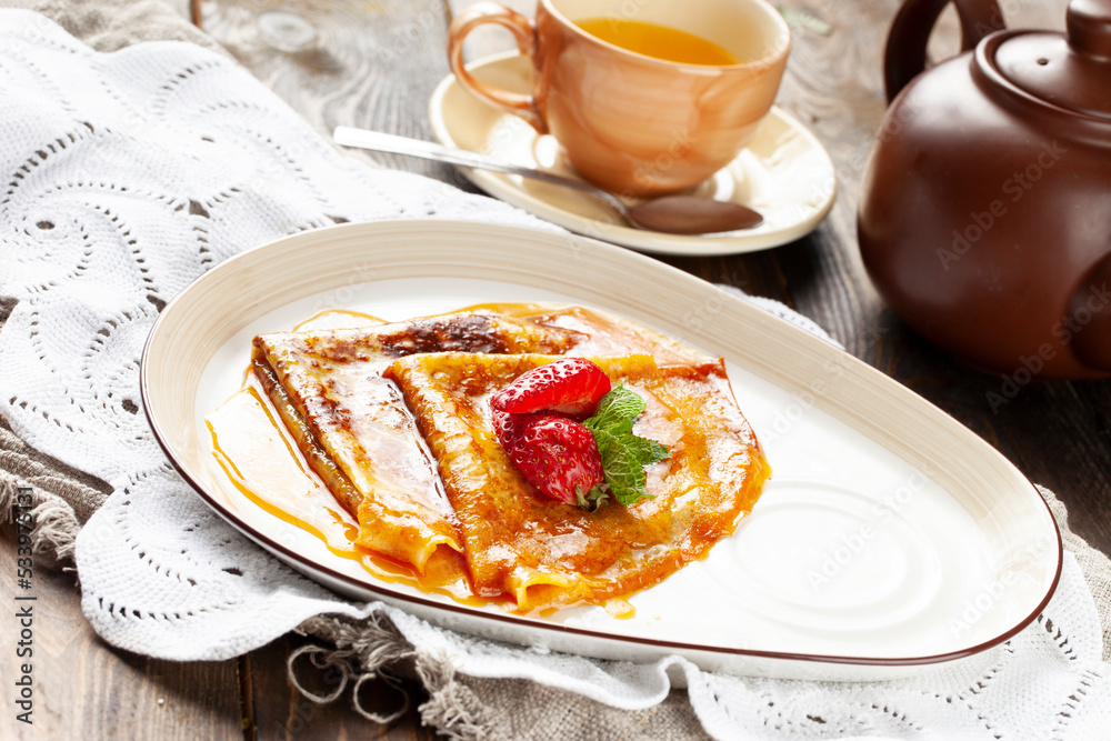 Pancakes with honey in a bowl. Pancakes with honey in a bowl.