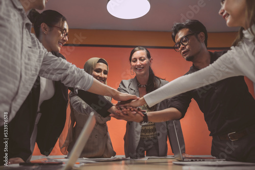 Success International business office meeting group. Cheerful organization team start conference with good support company empower. The office employee team celebrates a project in a convention room