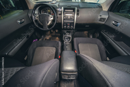 Car interior, dirty seat fabric. dirt and dust. Cleaning and washing concept. Vehicle care © Sergey