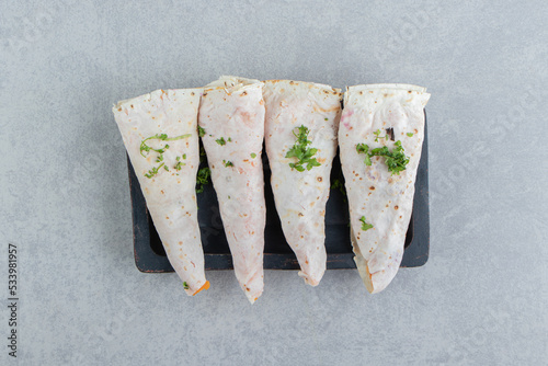 Freshly baked lavashs on the board , on the marble background