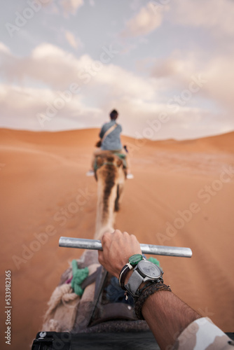 Riding a Moroccon Camels in the Sahara Desert