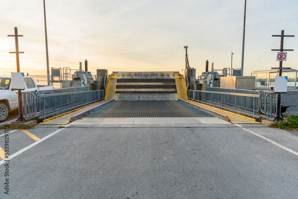 Loading ramp in a deserted ferry terminal at sunset