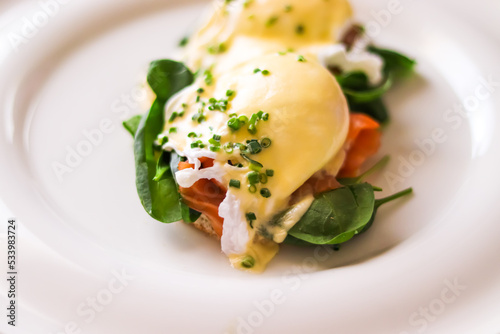 Fototapeta Naklejka Na Ścianę i Meble -  Luxury breakfast, brunch and food recipe, poached eggs with salmon and greens on gluten-free toast for restaurant menu and gastronomy branding