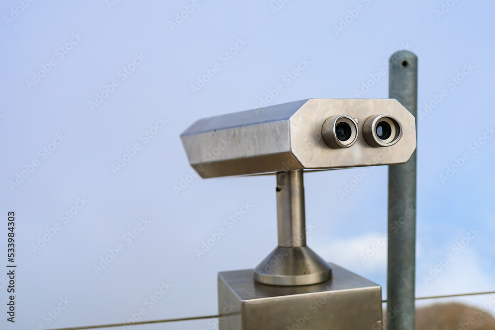 Paid binoculars for tourists in a resort place. Copy space background