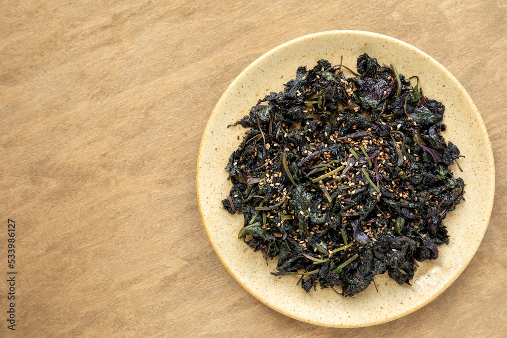 Asian style stir fried shiso (perilla) leaves with sesame seeds. Asian style stir fried shiso (perilla) leaves with sesame seeds.