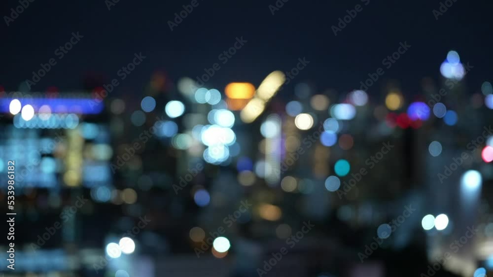Blur view of the city night horizontal view Bokeh blurred traffic on road at night. Blurred city lights at scenic evening with blue skies. Big city life