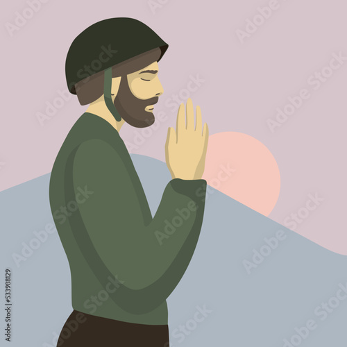 Soldier prays at sunset. Bearded military man. Stop war