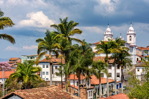 View of the historic center of the city of Diamantina with its colonial-style houses, church and palm trees photo
