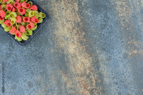 A tray of pasta ready to cook   on the marble background