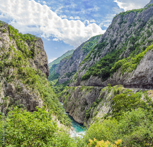 The purest waters of the turquoise color of the river Moraca flowing among the canyons. Travel around Montenegro concept photo