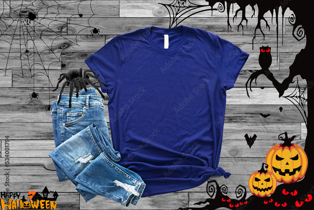 Obraz premium Mockup of a halloween Heather Midnight navy T-Shirt Blank Shirt Template Photo with Fall accessories and wooden background halloween shirt mockup