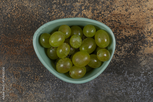 Pile of green grapes in blue bowl