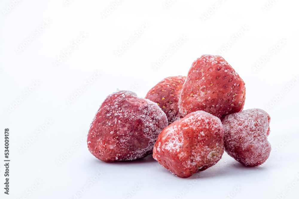 heap of frozen strawberry on white background with copy space heap of frozen strawberry on white background with copy space