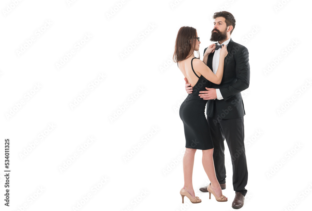 Being together. formal couple grooming for formal event. woman fix bow at males tuxedo. brutal man embrace his lady. couple in love. business meeting and partnership. love and romance Being together. formal couple grooming for formal event. woman fix bow at males tuxedo. brutal man embrace his lady. couple in love. business meeting and partnership. love and romance