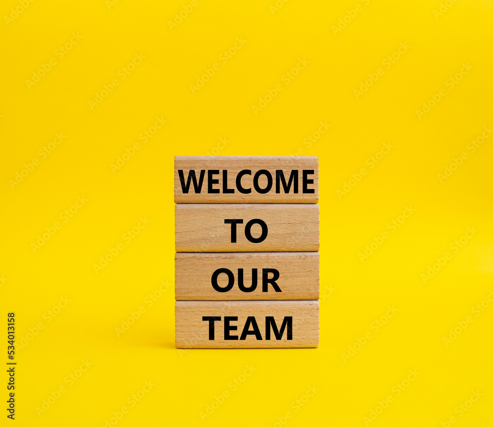 Welcome to our team symbol. Concept words Welcome to our team on wooden blocks. Beautiful yellow background. Business and Welcome to our team concept. Copy space. Welcome to our team symbol. Concept words Welcome to our team on wooden blocks. Beautiful yellow background. Business and Welcome to our team concept. Copy space.