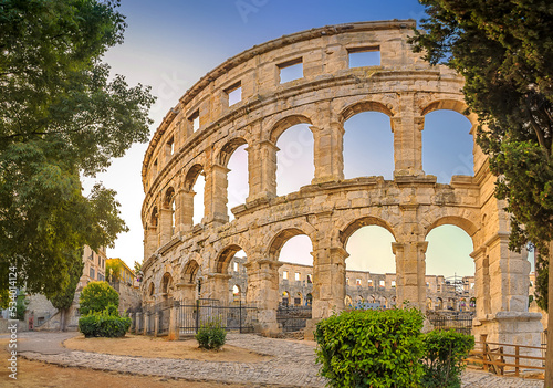 Panorama medieval Ancient Roman Amphitheater in Pula at dawn, Croatia. Architecture and landmark of Croatia. Travel concept background. photo