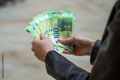 The girl counts euro bills. Close up female hands, count money as cash. Money calculation. Employee salary. Cash payment Successful business concept. Bank currency exchange