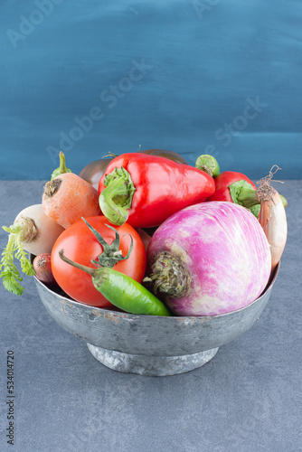 Assortment of fresh vegetables in iron bucket