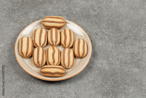 Chocolate striped biscuits on ceramic plate