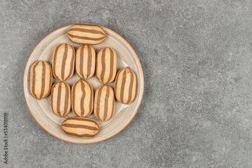 Chocolate striped biscuits on ceramic plate