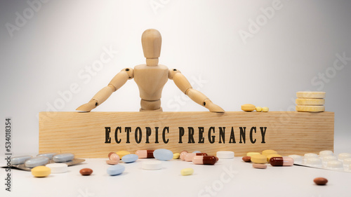 ectopic pregnancy disease. Written on wooden surface. On wood and medicine concept. white background. Diseases and treatments photo