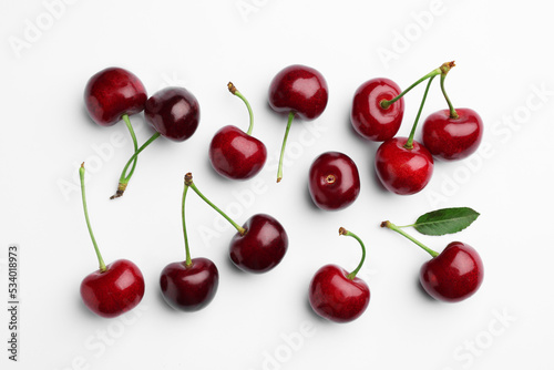 Canvas Print Many sweet ripe cherries on white background, flat lay