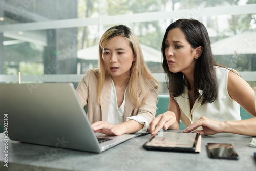 Anxious Businesswoman Checking Sales Data