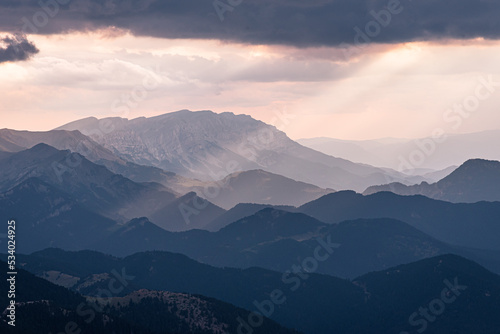 Sunset beams of light on the mountain range (Cadi-Moixero)