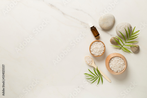 Composition with spa products on marble background, top view