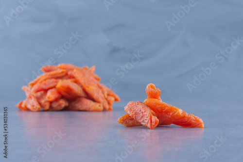a piece of dried fruit , on the marble background