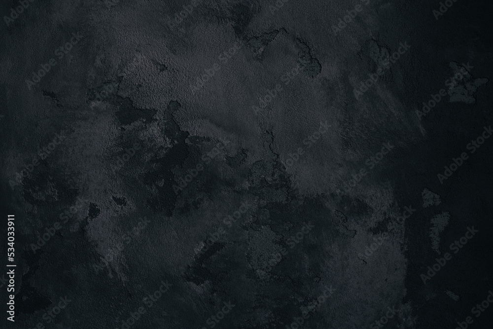 abstract background texture of a dark stone similar to the lunar surface. Texture of black matter.