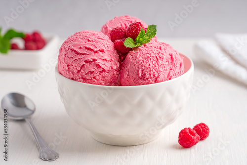 Fotografie Scoops of sweet refreshing homemade pink berry ice cream or organic sorbet made