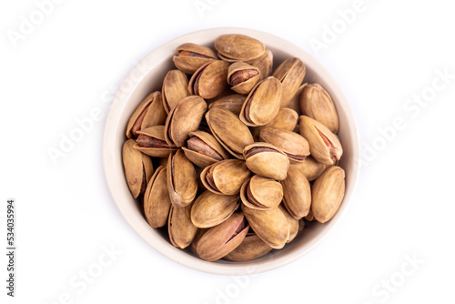 Pistachio in a white porcelain bowl photo