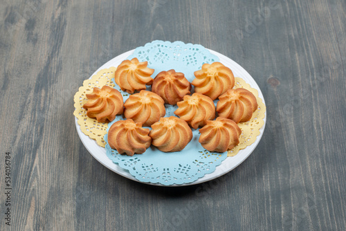 Sweet delicious browned shortbread cookies in a white plate