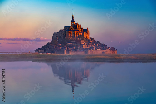 Breathtaking sunrise at the famous Le Mont Saint-Michel tidal island , Normandy, France