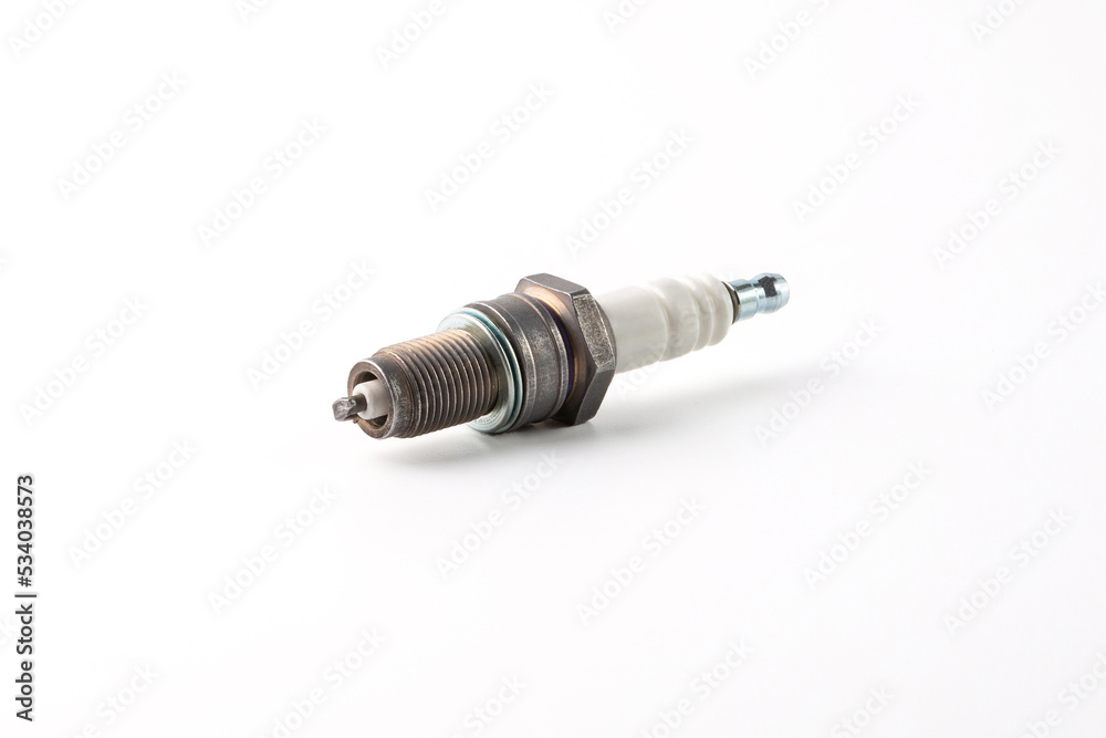 New spark plug on white background, isolated. New spark plug on white background, isolated.