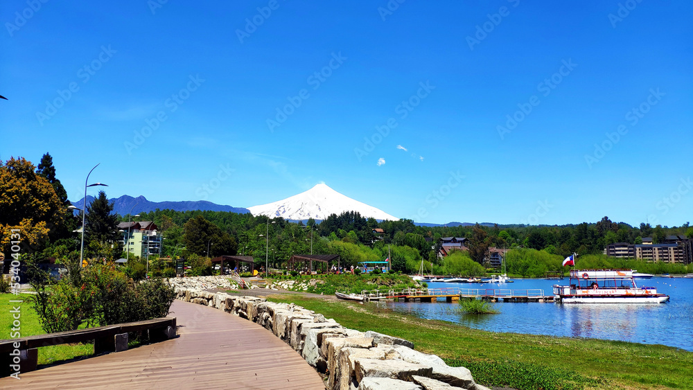Pucon waterfront and Villarrica Volcano on the background, Chile.
