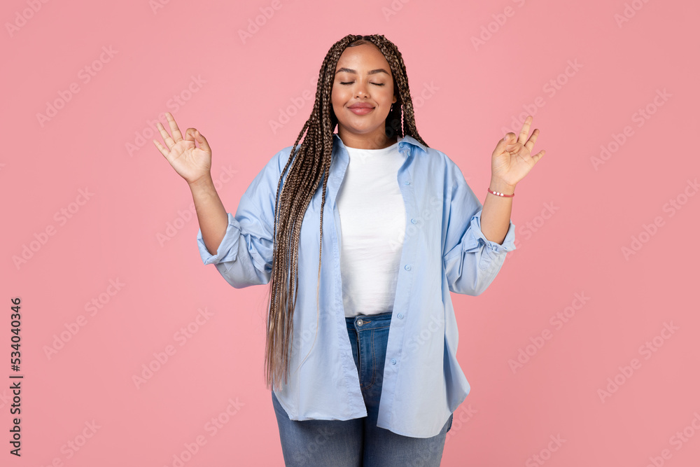 Peaceful Black Plus Size Lady Meditating Closing Eyes, Pink Background Peaceful Black Plus Size Lady Meditating Closing Eyes, Pink Background