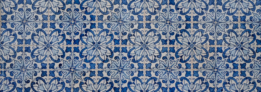 Azulejos in Portugal, detail on a typical house, colorful background
