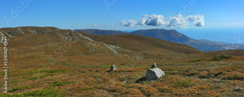Panoramic view of the mountain plateau and 'Demerdzhi' mount on the Crimean peninsula. The mountainous area of the highest peaks of the Crimean mountains. photo