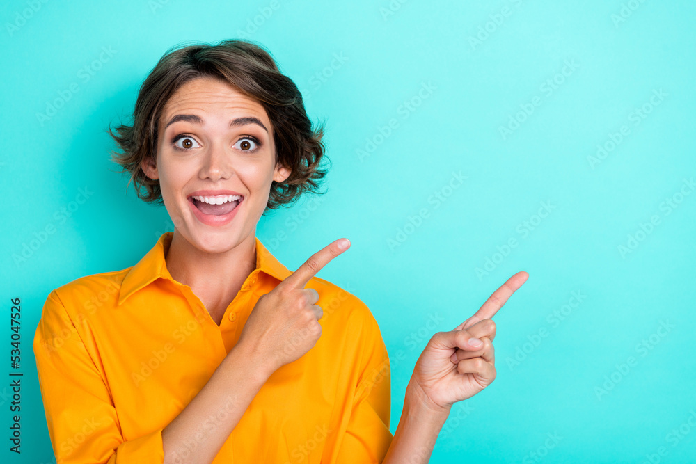 Photo of sweet gorgeous pretty girl bob hairdo dressed yellow blouse directing empty space promo isolated on turquoise color background Photo of sweet gorgeous pretty girl bob hairdo dressed yellow blouse directing empty space promo isolated on turquoise color background