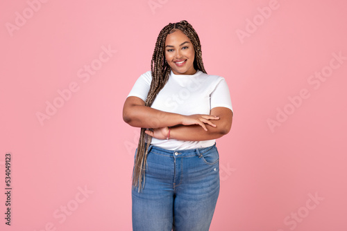 Fotografie Attractive African American Overweight Woman Standing Posing Over Pink Backgroun