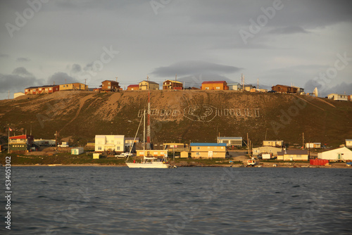 View of the community of Pond Inlet and the Pond Inlet sign in the north Baffin Region of Nunavut, Canada