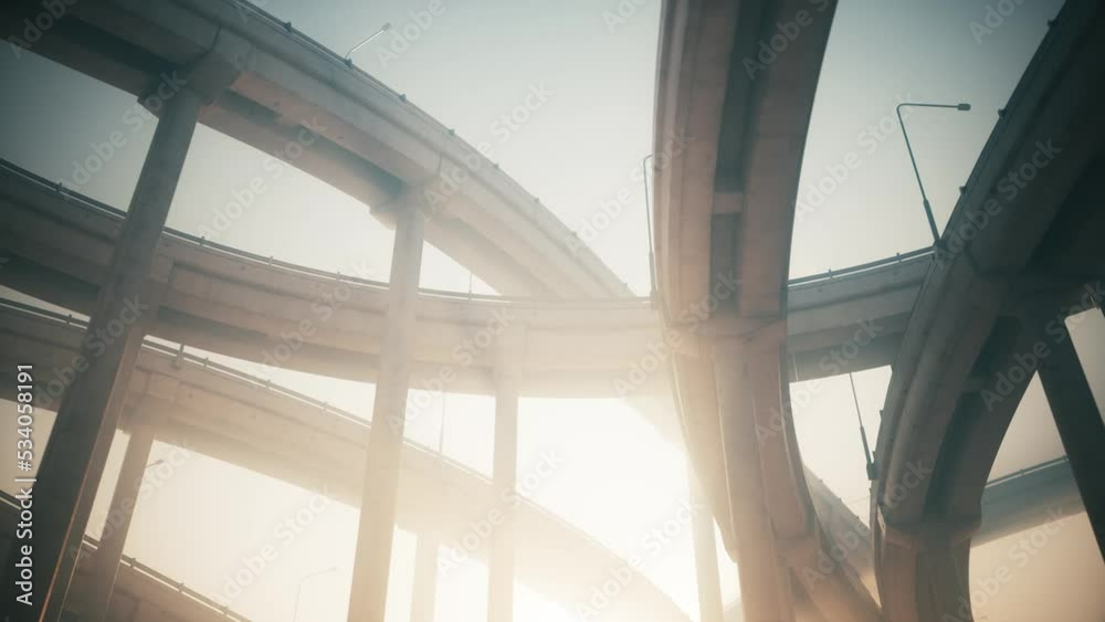 Overpass from below. Underneath of road junction. Automobile overpass view from below
