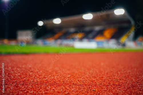 Track and field background. Red athletics track. Blurred background