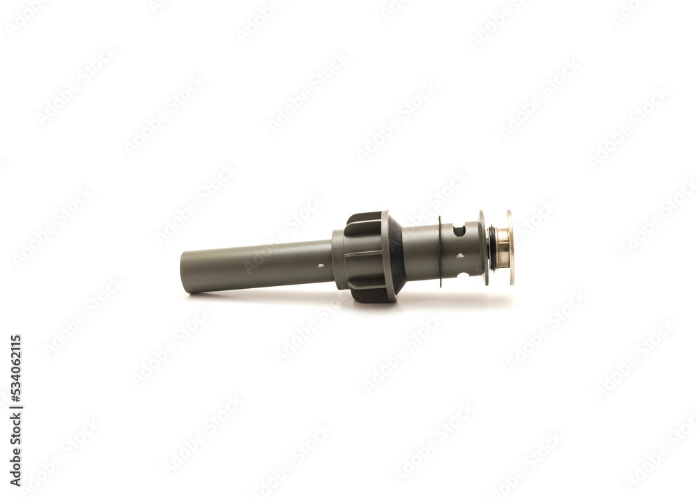 Side view of brand new push down drain stopper with overflow hole allows water to drain from the sink hole into the drain isolated on white background Side view of brand new push down drain stopper with overflow hole allows water to drain from the sink hole into the drain isolated on white background